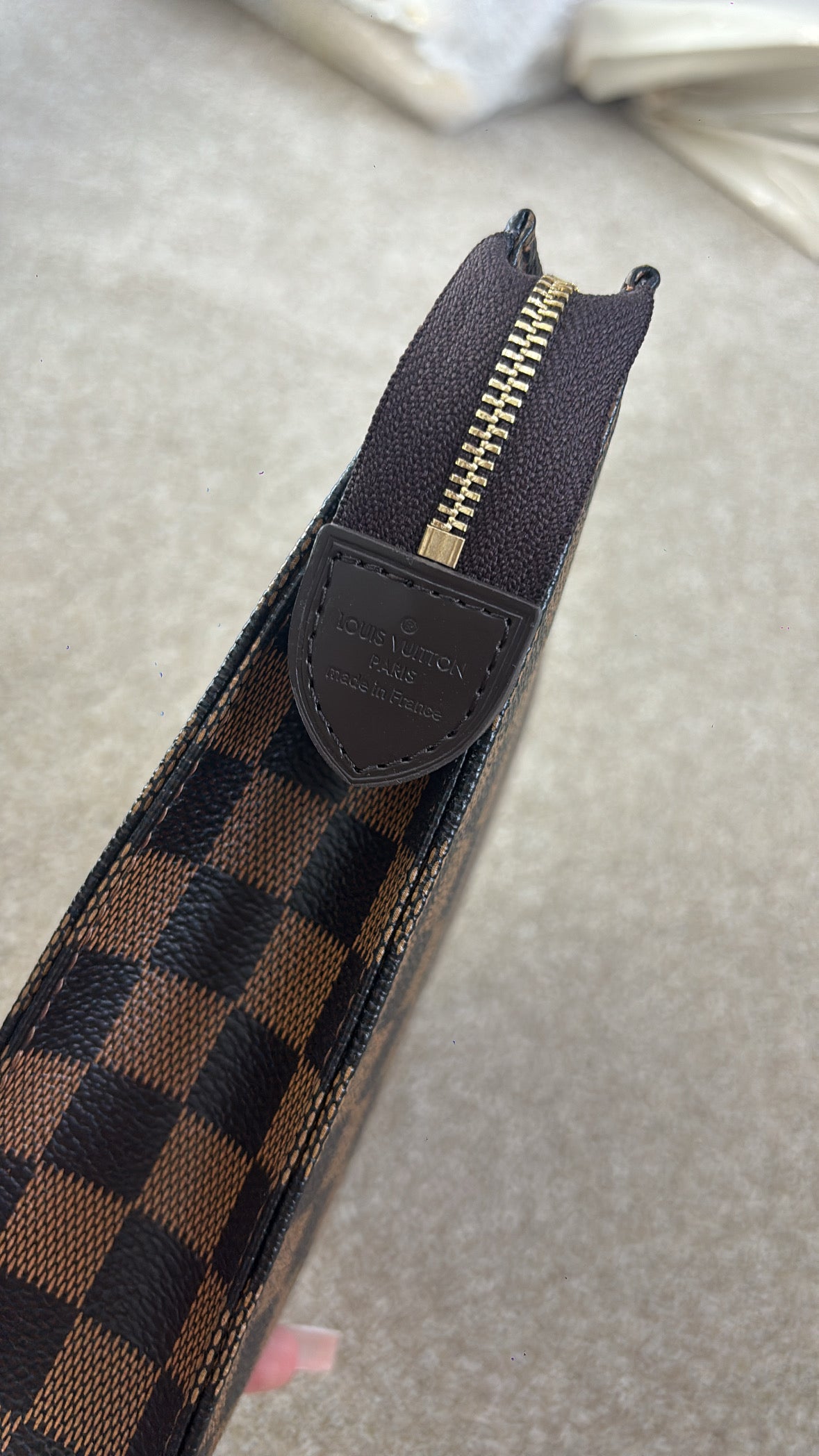 Brown grid clutch bag