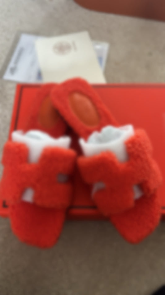 Orange fluffy sliders size 5
