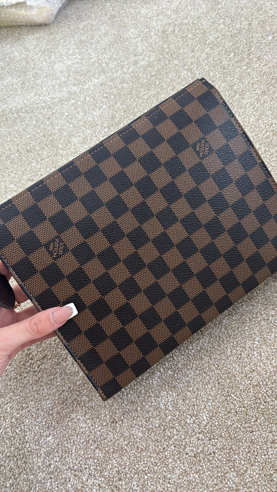 Brown grid clutch bag