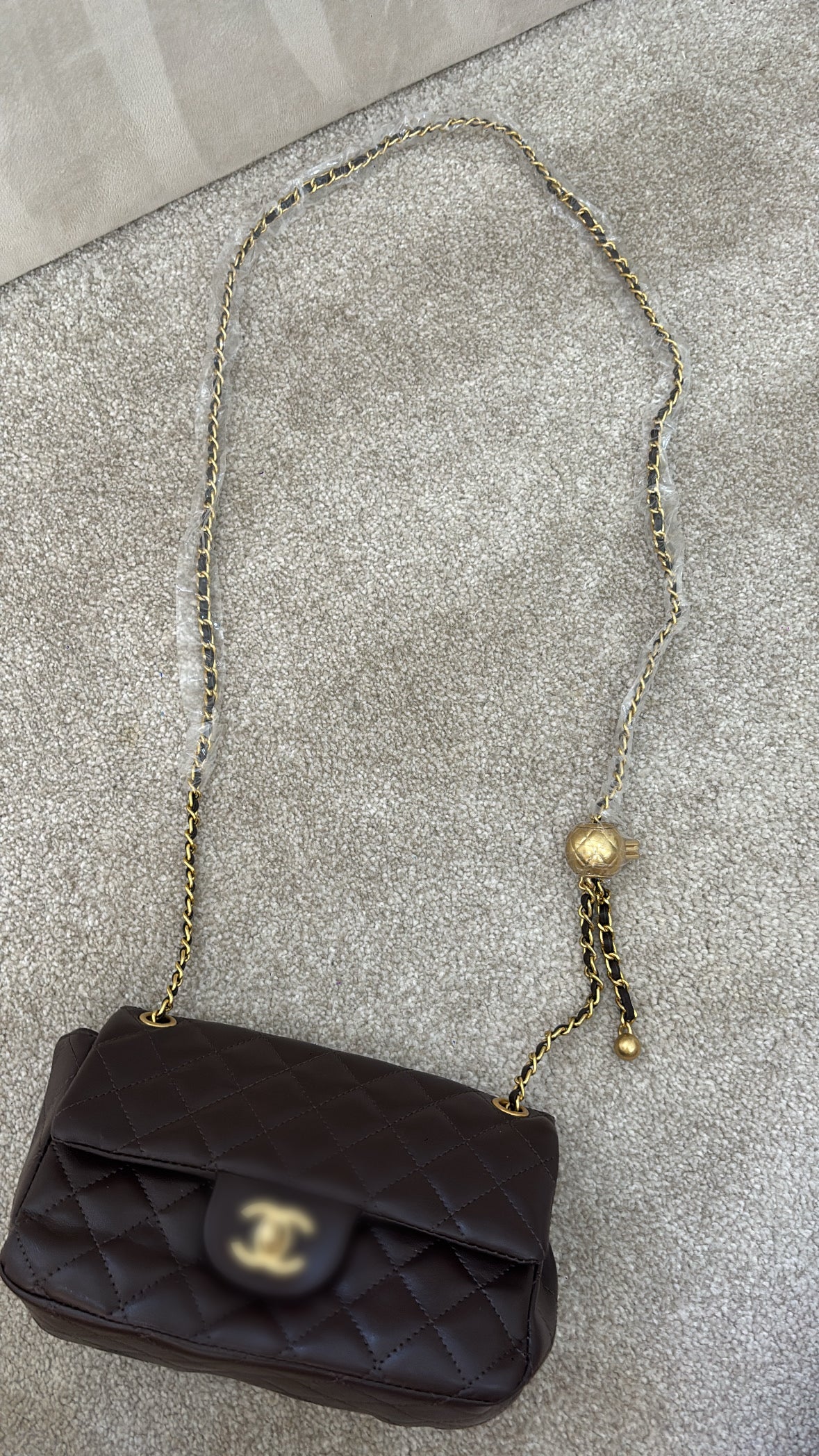 Brown mini C crossover bag